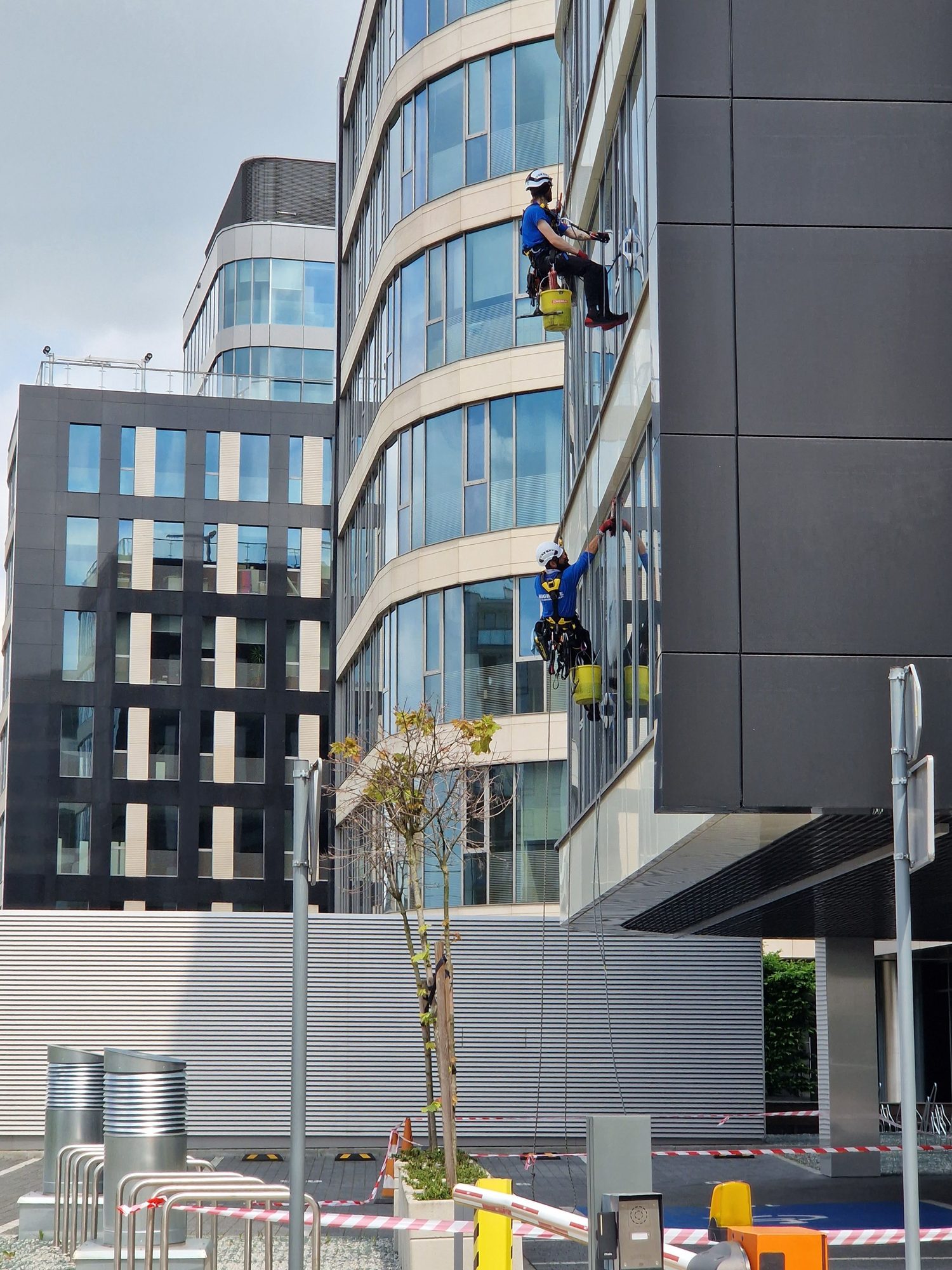 Vantage FM technicians working at height on a commercial building facade
